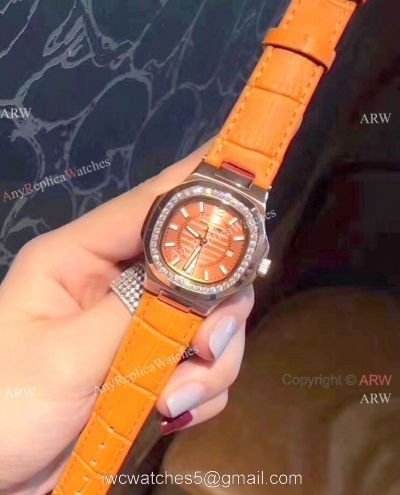 Copy Patek Philippe Nautilus Womens Watch Diamond Bezel Orange Watch watches