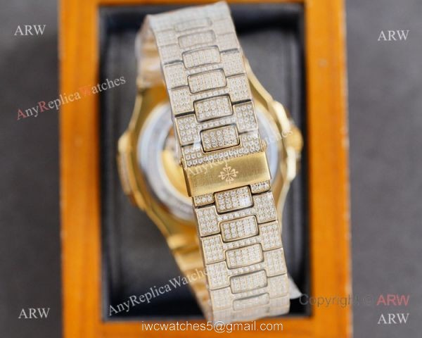 Swiss AAA Replica Patek Philippe Nautilus Iced Out Yellow Gold Watch 40mm 9015 Ultra-thin Movement