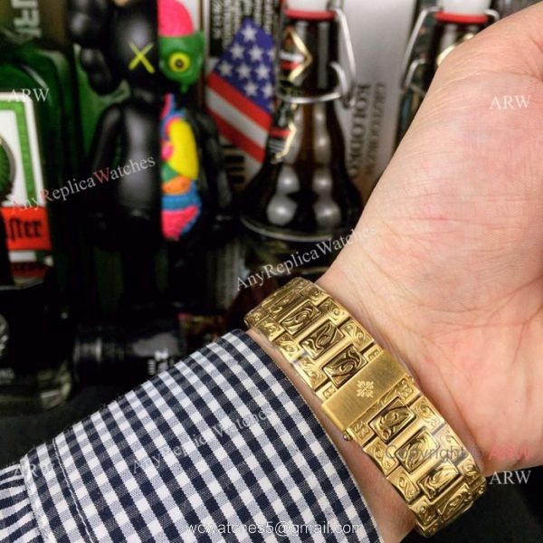 New Fake Patek Philippe Engraving Nautilus Silver Face Yellow Gold Watch For Sale New Fake Patek Philippe Engraving Nautilus Silver Face Yellow Gold Watch For Sale