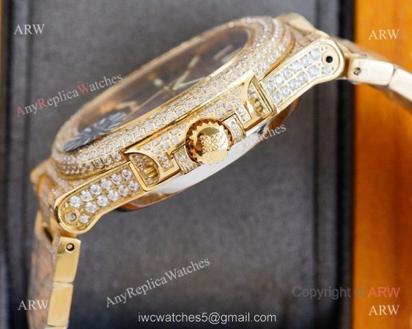 Swiss AAA Replica Patek Philippe Nautilus Iced Out Yellow Gold Watch 40mm 9015 Ultra-thin Movement